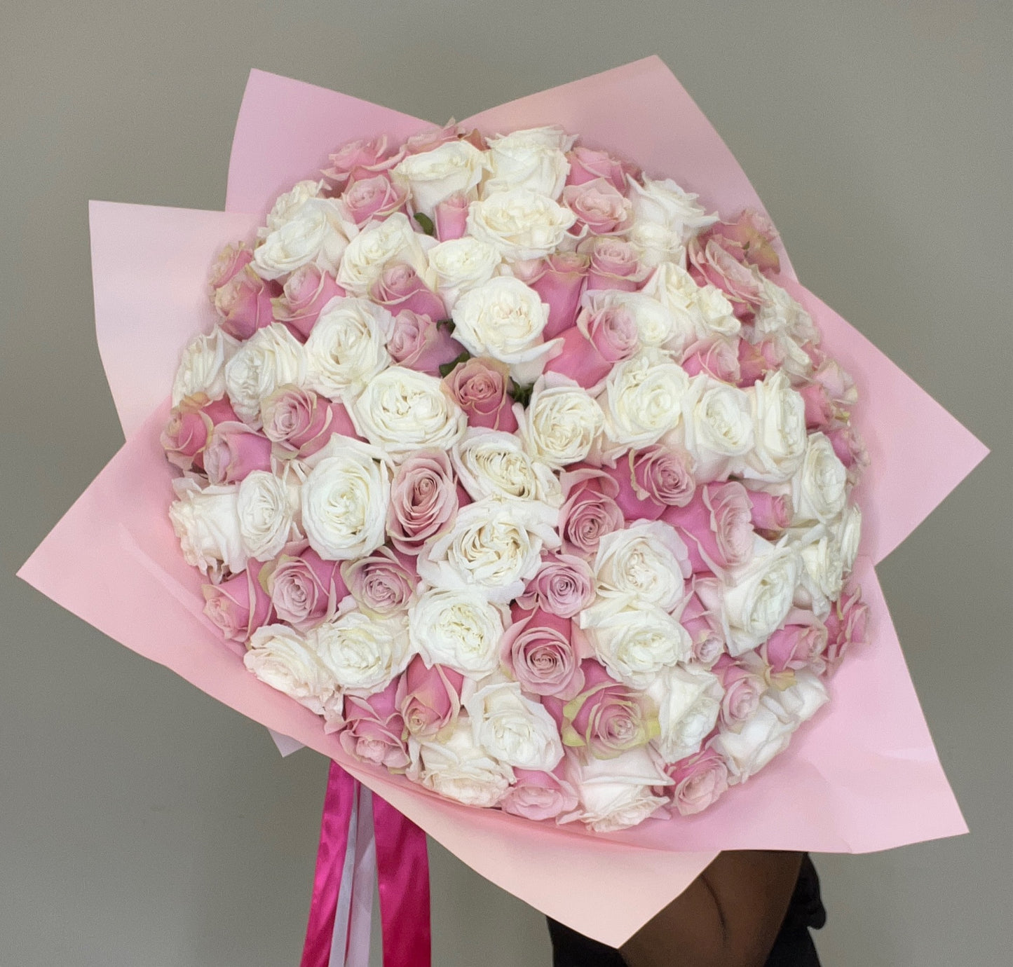 A captivating arrangement of light pink and white roses, radiating charm and elegance. Perfect for any occasion, this bouquet embodies grace and sophistication. Ideal for expressing purity and admiration. Available for same-day delivery in Miami, FL